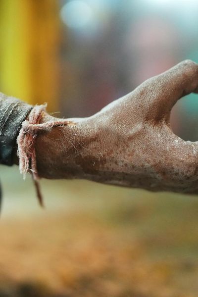 Close-up of hands in a specific yoga mudra gesture.
